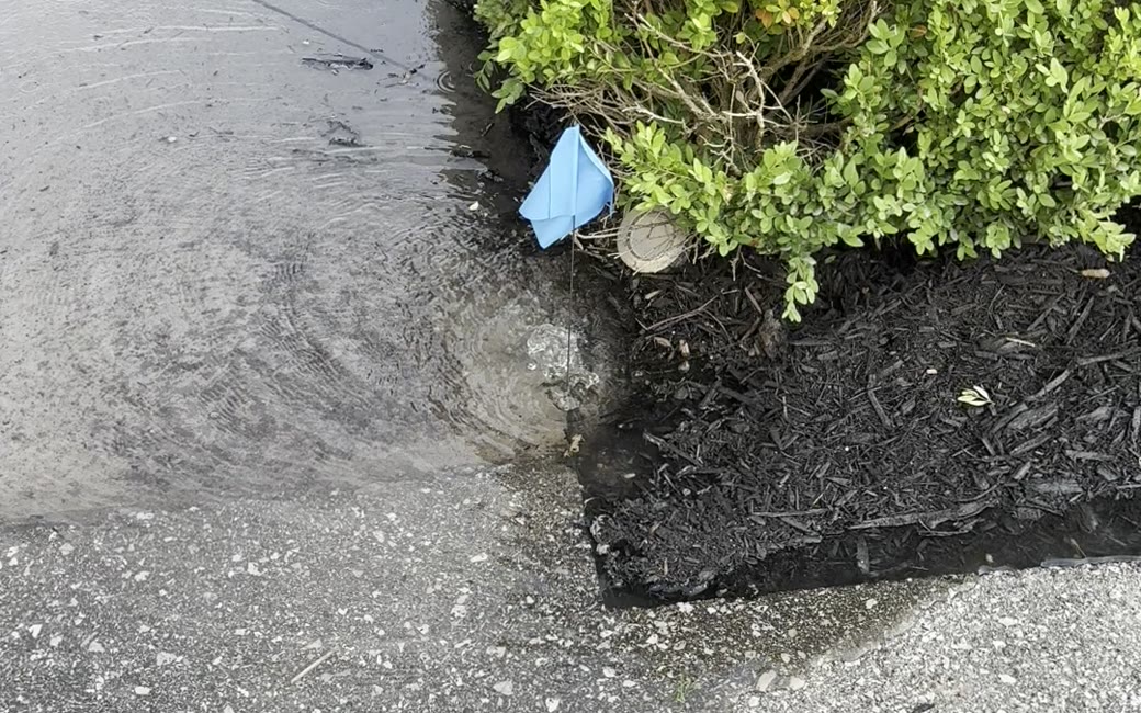 Water pooling on a walkway from a leaking sprinkler valve — PJL Land Services