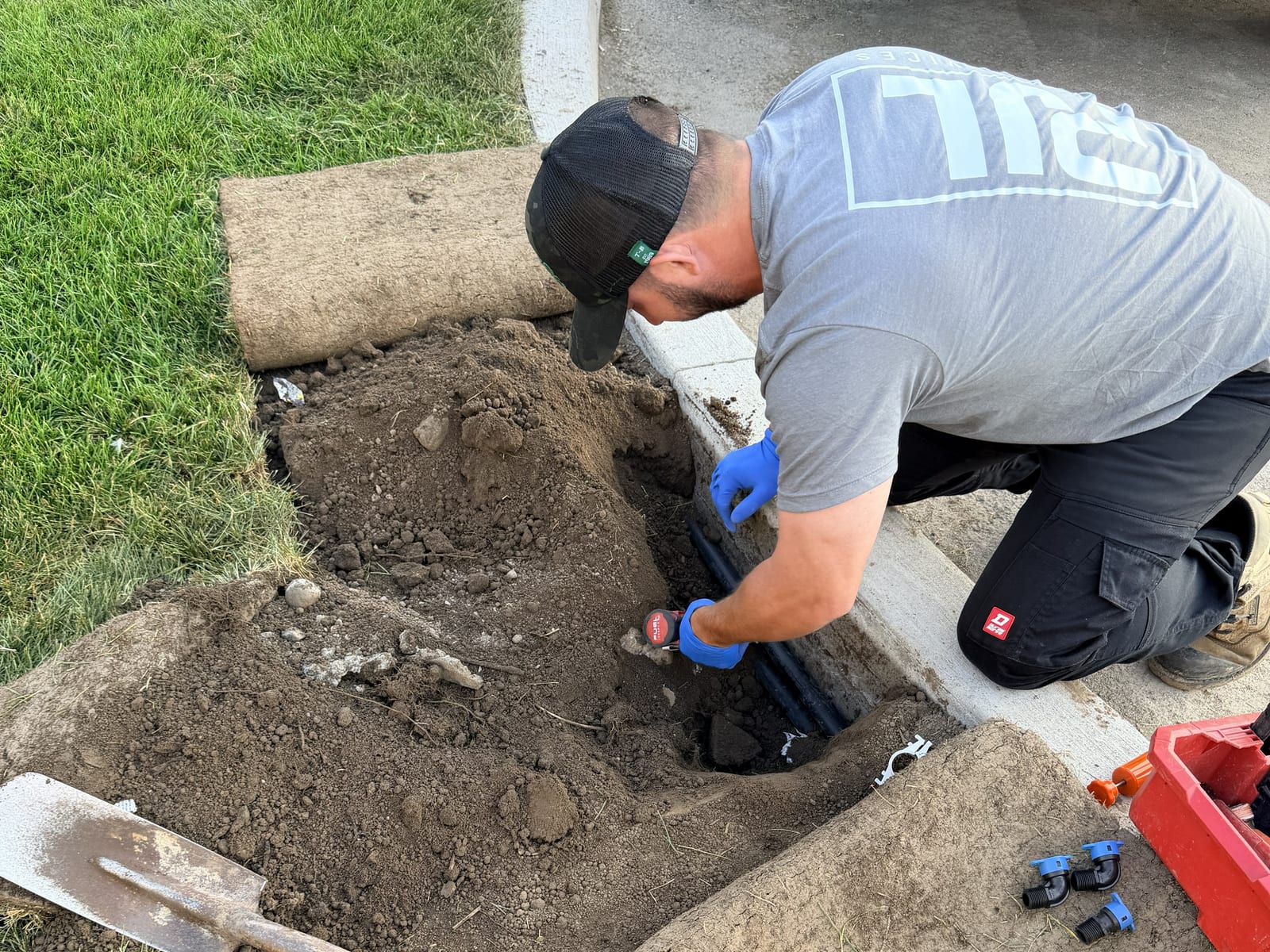 Sprinkler repair in progress during an in-season visit in Forest Hill